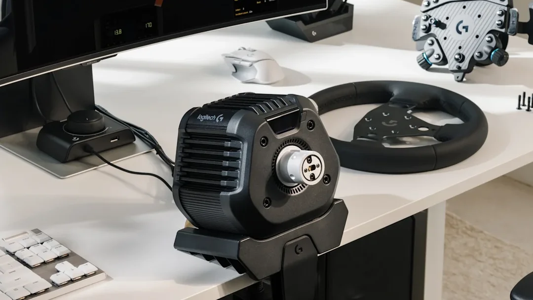 Logitech RS50 wheel base mounted to a desk using table clamp
